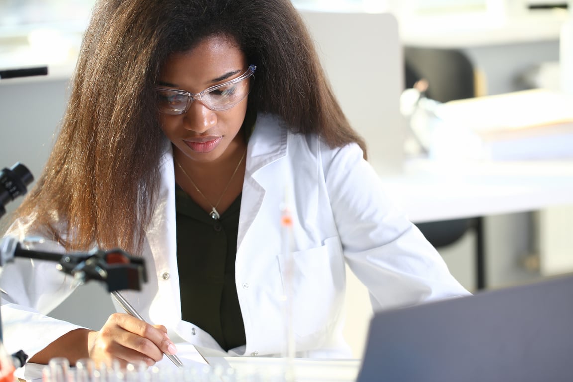 Black female chemist student conducting research